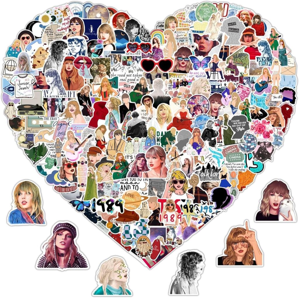 Picture of many small Taylor Swift stickers that are arranged in the shape of a heart. Examples of the stickers are cartoon pictures of Taylor and names of her songs and albums